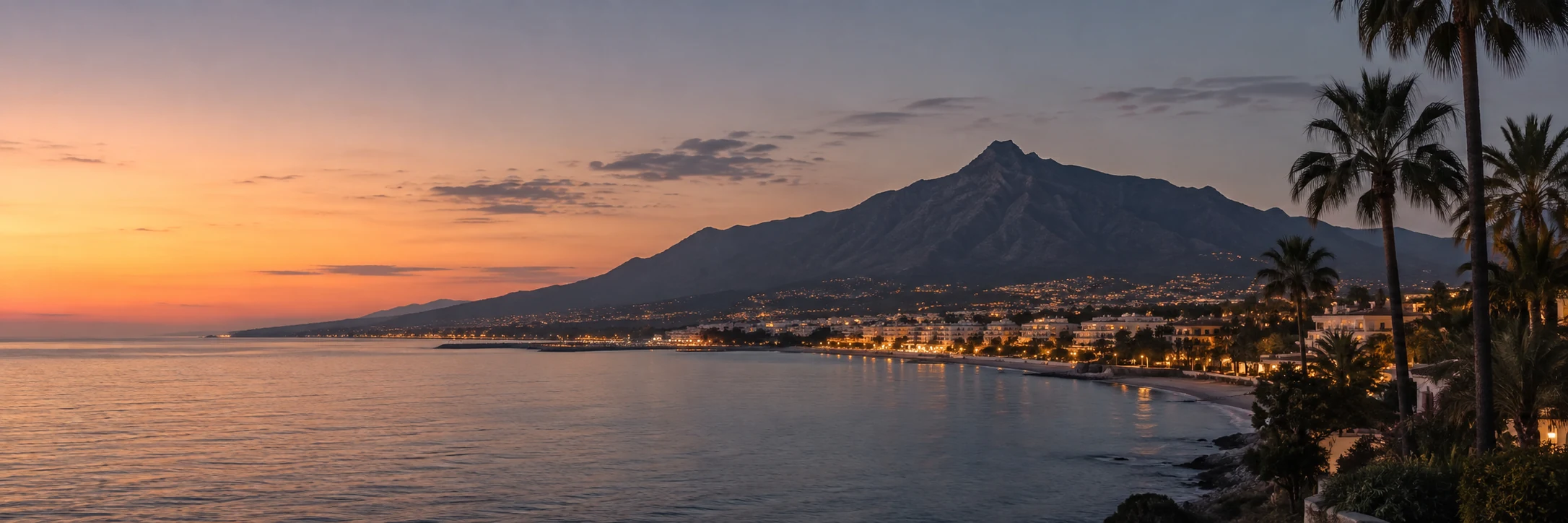 Marbella coastline at twilight beneath La Concha mountain
